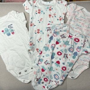 Carter’s NB onsie set of 4